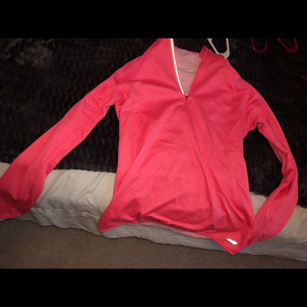A pink half zip jacket
